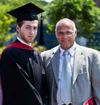 Toronto High School's alumni graduating from university with his happy father. یکی از دانش آموزان موفق ِ Dabirestan Toronto High School درجشن فارغ التحصیلی